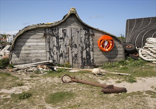 Upturned boat used as storage shed, Holy Island, Lindisfarne, Northumberland, England, UK
