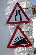 Red triangular signs for narrow steep road, St Mawes, Cornwall, England, United Kingdom, Europe