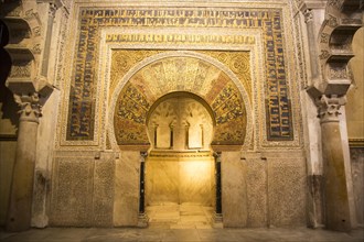 Richly inscribed stonework of keyhole shaped Mihrab, the centrepiece of the Great Mosque, Cordoba,