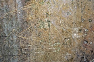 Old graffiti of galleon sailing ship carved on rampart wall of the citadel at Brouage,