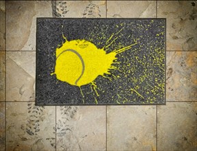Doormat with a printed tennis ball
