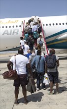 Passengers boarding Oman Airways plane, Seeb International Airport, Muscat, Oman, Asia