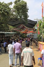 People walking to and from Koneswaram Kovil Hindu temple, Trincomalee, Sri Lanka, Asia