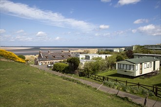 Tourist accommodation at Budle Bay, Northumberland coast, England, UK