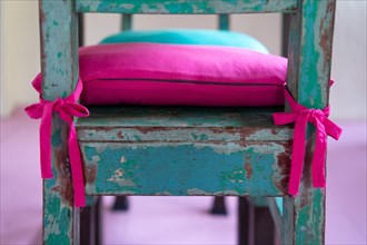 Pink cushion on a green wooden chair, Pondicherry or Puducherry, Tamil Nadu, India, Asia