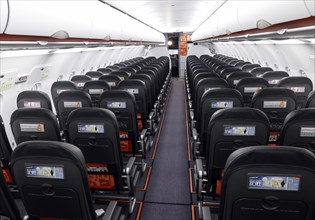 View into an empty aircraft compartment of an easyJet Airbus A320 neo in the newly opened easyJet