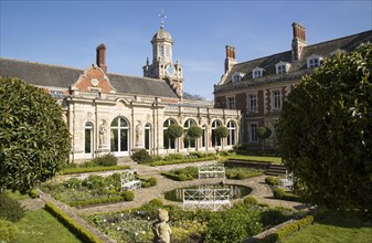 The White Garden and clock tower at Somerleyton Hall country house, near Lowestoft, Suffolk,