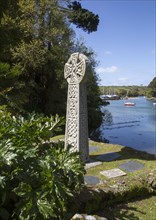 Celtic cross gravestone by River Fal, St Just in Roseland, Cornwall, England, UK