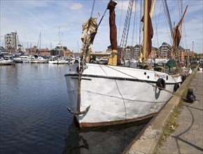 Historic sailing barge at quayside mooring in the Wet Dock, Ipswich, Suffolk, England, United
