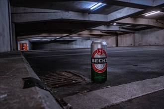 A Beck's beer can in the foreground in a gloomy car park, Pforzheim, Germany, Europe