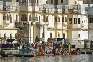 Women bathing in the Ahar River in the city of Udaipur, City of Lakes, Rajasthan, India, Asia