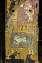 Section of the Berlin wall showing graffiti with rabbits in the Memorial de Caen, museum and war