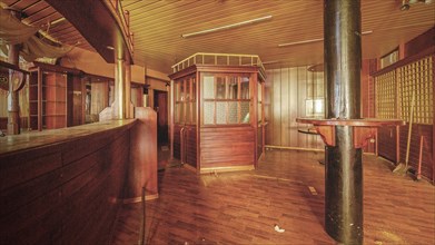 Abandoned bar with wooden counter and interior design that conveys a nostalgic atmosphere, Bad am