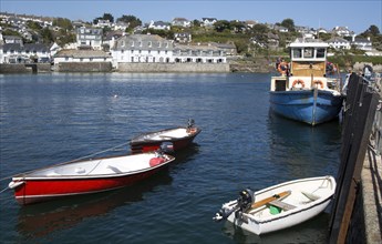 Ferry boat and dinghies in the harbour, St Mawes, Cornwall, England, UK