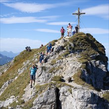 Hikers at the summit of the Grosse Klammspitze, Graswangtal, Ammergau Alps nature park Park, Upper