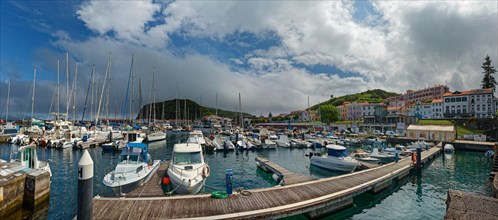 Lively harbour of Horta with many boats and surrounding mountains, Horta, Faial Island, Azores,