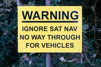Sign warning ignore Sat Nav no through way for vehicles, Melton, Suffolk, England, UK
