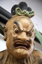 Close up of angry Buddha face Gangaramaya Buddhist Temple, Colombo, Sri Lanka, Asia