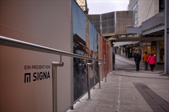 Construction site, controversial building project of Rene Benko's insolvent company Signa, logo,