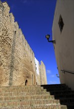 Historic street and castle walls in the village of Vejer de la Frontera, Cadiz Province, Spain,