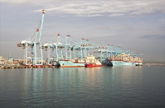 Large cranes at APM Terminals loading container ships port at Algeciras, Cadiz Province, Spain,