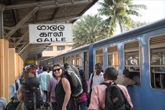 Passengers on platform at Galle railway station, Sri Lanka, Asia