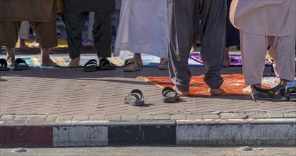 Midday prayer in front of a mosque, Al Fahidi neighbourhood, Dubai, United Arab Emirates, Asia