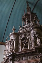 Renaissance-style carved canopy of the baptismal font, Enclos Paroissial enclosed parish of