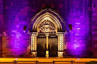 Illuminated portal of a Gothic church, Collegiale Sant Martin de Colmar, Colmar, Alsace, France,