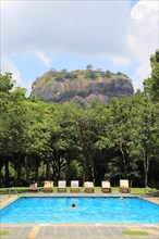 Swimming pool view to Rock Palace at Hotel Sigiriya, Sigiriya, Central Province, Sri Lanka, Asia