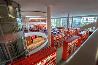 Modern library with red bookshelves and vaulted architecture, Pforzheim, Germany, Europe