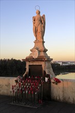 Statue of angel San Rafael on Roman bridge, Cordoba, Spain, Europe