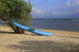 Canoe on sandy tropical beach at Pasikudah Bay, Eastern Province, Sri Lanka, Asia