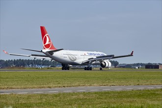 Turkish Airlines Airbus A330-223 with registration TC-LOH lands on the Polderbaan, Amsterdam