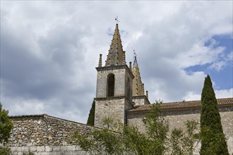 Church tower of L'Abbatiale de Goudargues in Goudargues, Departement Gard, Occitanie region,