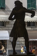 Silhouette of the bronze statue of the violinist Niccolo Paganini by the artist Niccolo Tommaseo,