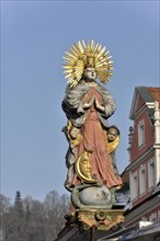 In the foreground figure of the market fountain, Schwaebisch Gmuend, Baden-Wuerttemberg, Germany,