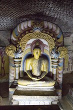 Buddha figure inside Dambulla cave Buddhist temple complex, Sri Lanka, Asia
