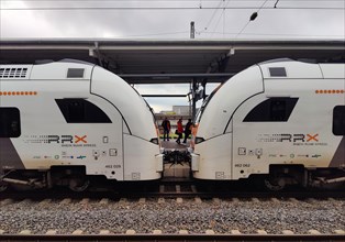 Two railcars facing each other with a view at the main railway station, Witten, North