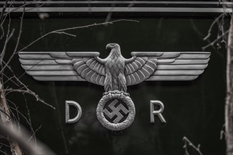 An eagle emblem with spread wings and a swastika, symbol from the time of the Second World War,