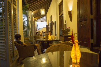 Evening drinks colonial style veranda bar of Galle Fort Hotel, historic town of Galle, Sri Lanka,