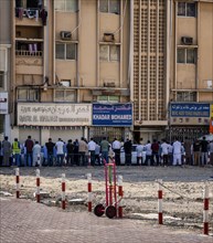 Midday prayer in front of a mosque, Al Fahidi neighbourhood, Dubai, United Arab Emirates, Asia