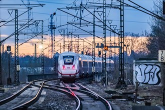 Railway line with many overhead lines and railway signals, InterCityExpress ICE of Deutsche Bahn