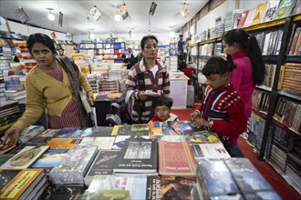 Book readers browsing books at a stall during Assam Book Fair, in Guwahati, Assam, India on 29
