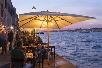 Restaurant on the waterfront of the Guidecca Canal, Dorsoduro district, Venice, Veneto, Italy,