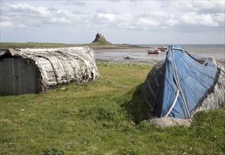 Upturned boats used as storage shed, Holy Island, Lindisfarne, Northumberland, England, UK