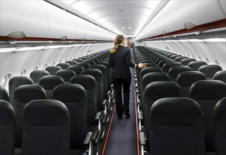 View into an empty aircraft compartment of an easyJet Airbus A320 neo in the newly opened easyJet