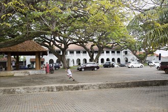 Child running across historic Court Square in the town of Galle, Sri Lanka, Asia