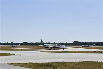 Eva Air Dreamliner, SunExpress and Anadolujet Airlines aircraft taxiing on the taxiways at Runway