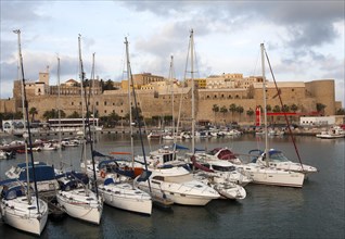 Yachts in harbour and old walled fortress Melilla la Vieja, Melilla, Spanish territory in north